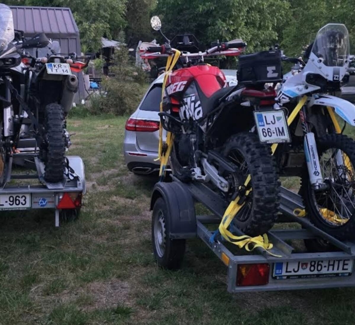 TET riders' motorcycles loaded on trailers at Teddy Camp, Kosovo